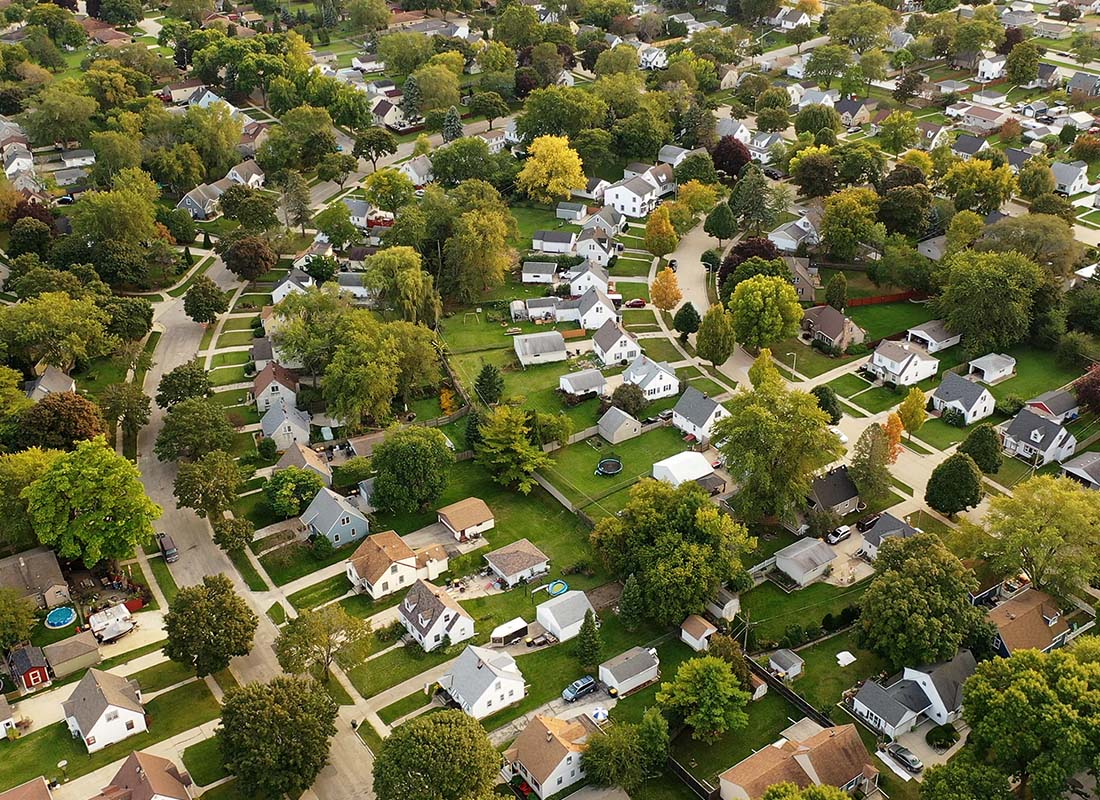 Denmark, WI - Aerial View of Residential Homes With Trees